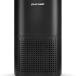 Black PuroAir air purifier with a cylindrical design, smooth upper housing, and perforated lower intake vents on a light background