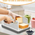 Adjustable bread slicer cutting even slices of bread on kitchen counter