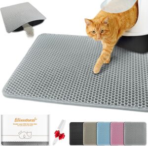 Cat stepping out of litter box onto gray litter catching mat with mesh texture