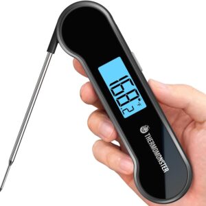 hand holdingn instant read thermometer with digital readout and open with temperature guage showing